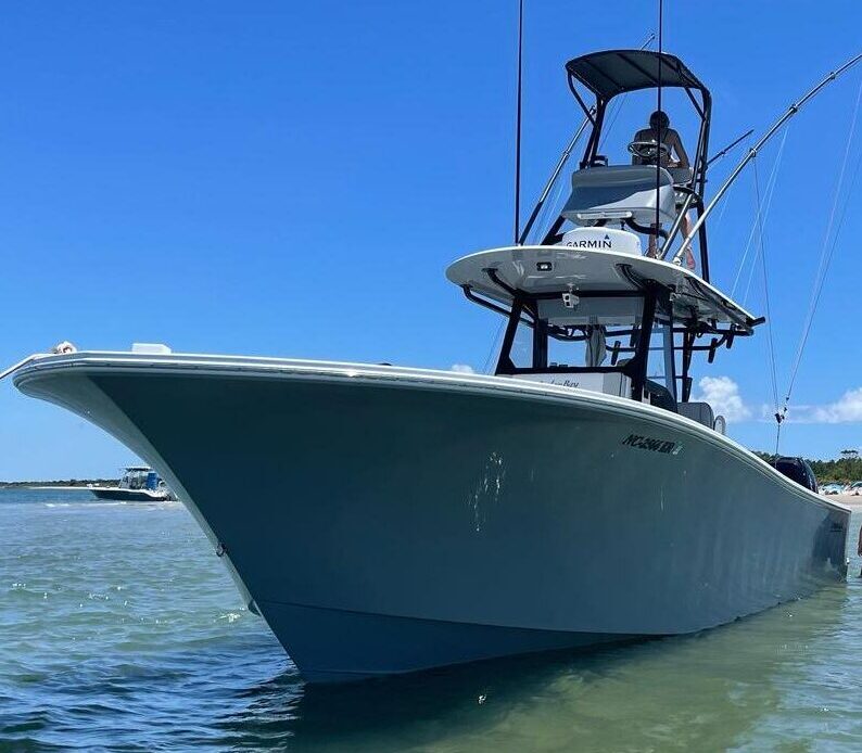 A center-console fishing boat on calm water